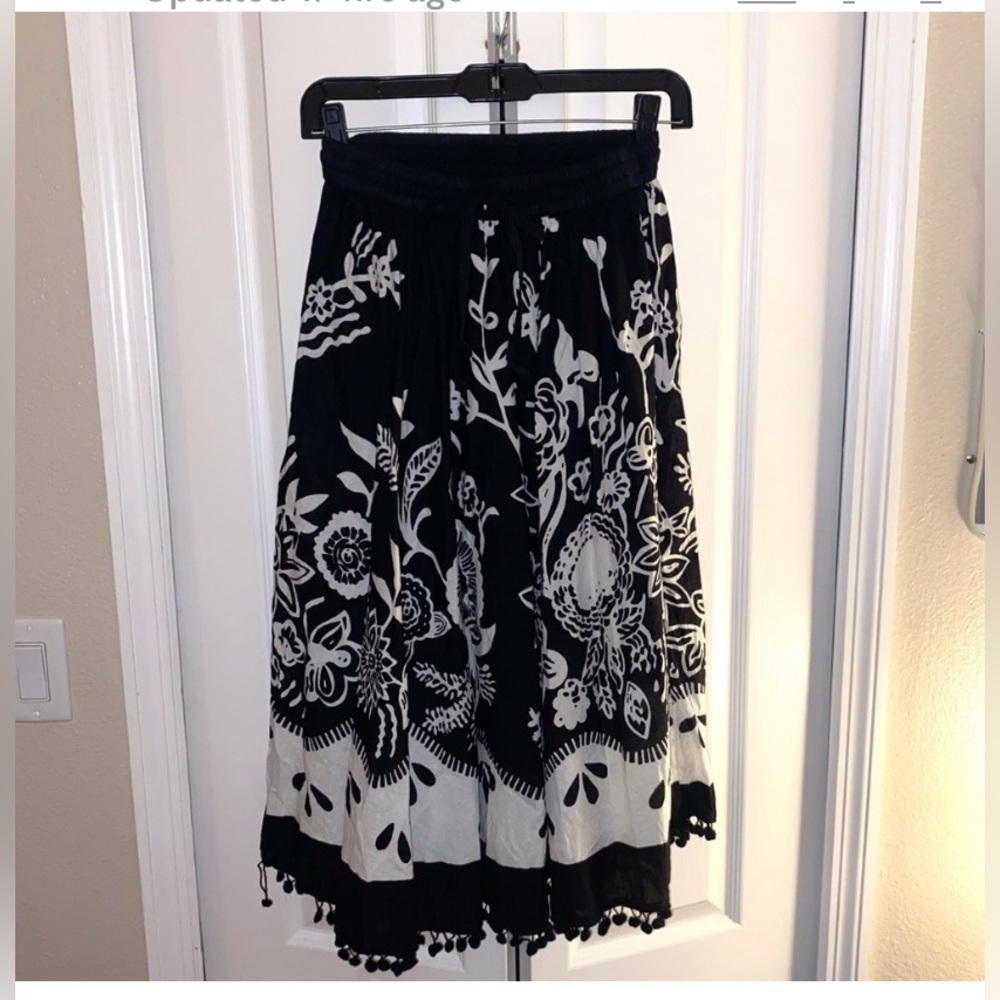 Like New, Black & White Embellished Midi A-Line Skirt in a women’s size small.